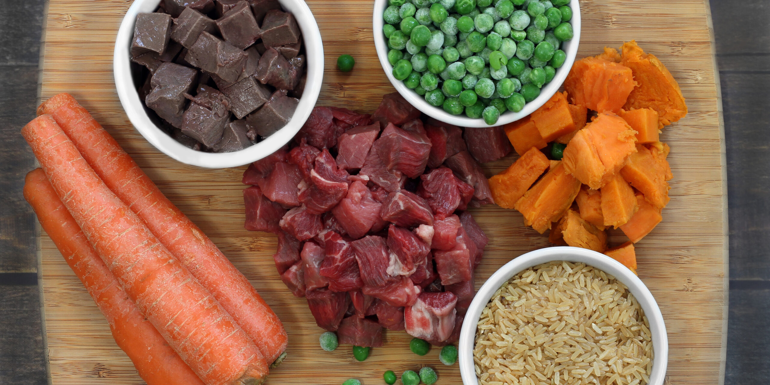 Ingredients for dog food on a cutting board