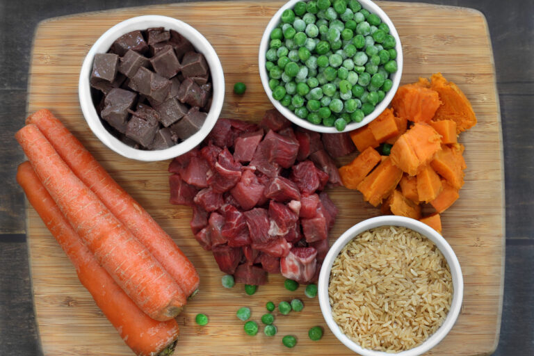 Ingredients for dog food on a cutting board